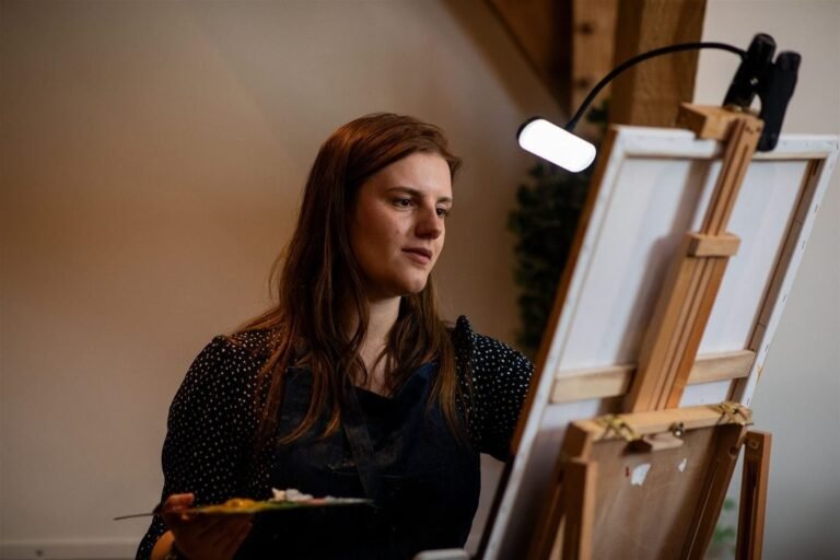 Katie Bowden painting live at her easel