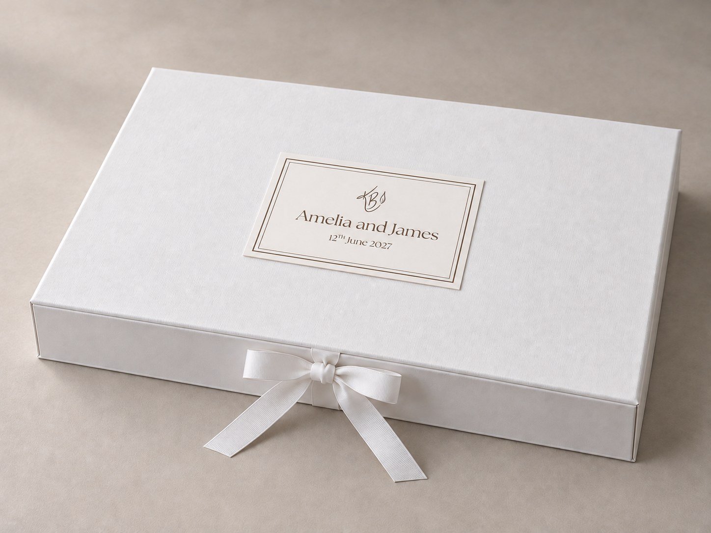 Katie Bowden Art white magnetic keepsake box with a ribbon bow and a personalised name card
